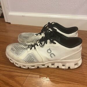 On Running White and Black Athletic Shoes